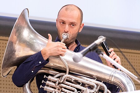 A member of the quintet gives a lecture on the characteristics of his instrument.