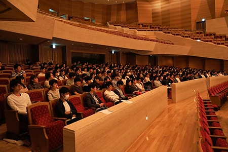 Students watch the rehearsal closely.