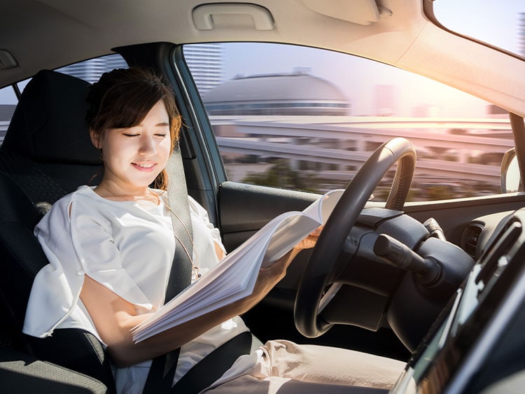 A woman riding the autonomous car