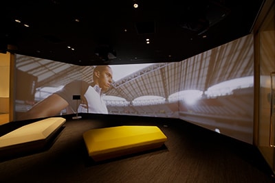Screening of the latest corporate branding movie in a wide screen theater
