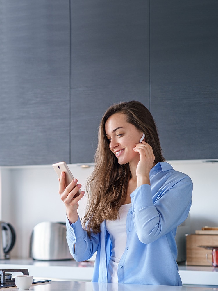 Woman operating a smart hearables